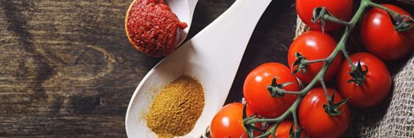 Branch with fresh cherry tomatoes. Ripe red tomatoes